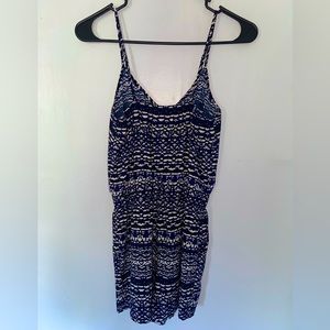 Navy blue romper with pockets and adjustable straps. Size small